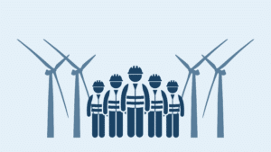 a group of workers standing between two sets of two windmills