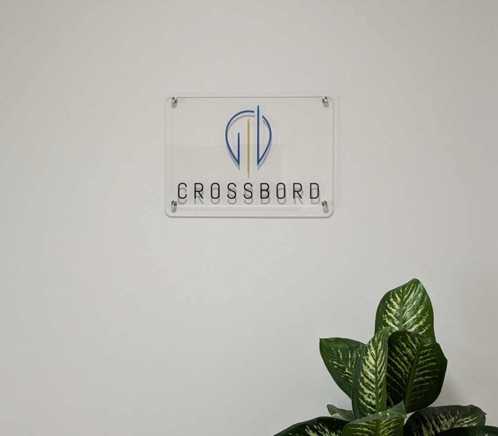 Crossbord logo sign and green plant